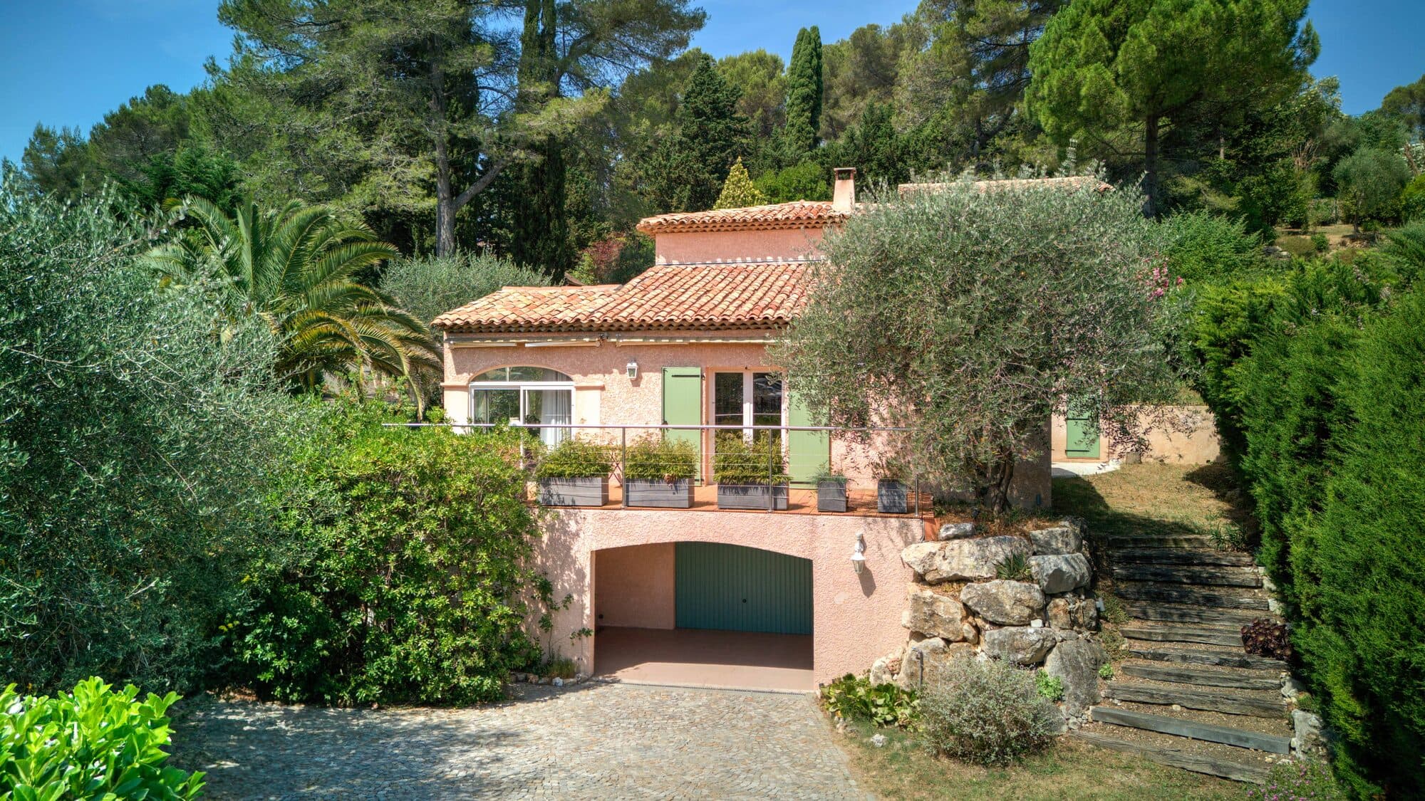 Provençal villa surrounded by olive and pine trees