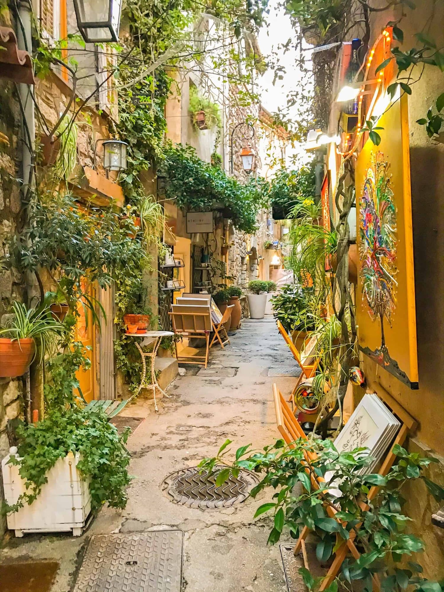 A flower-lined lane in the old village of Mougins, with galleries and studios